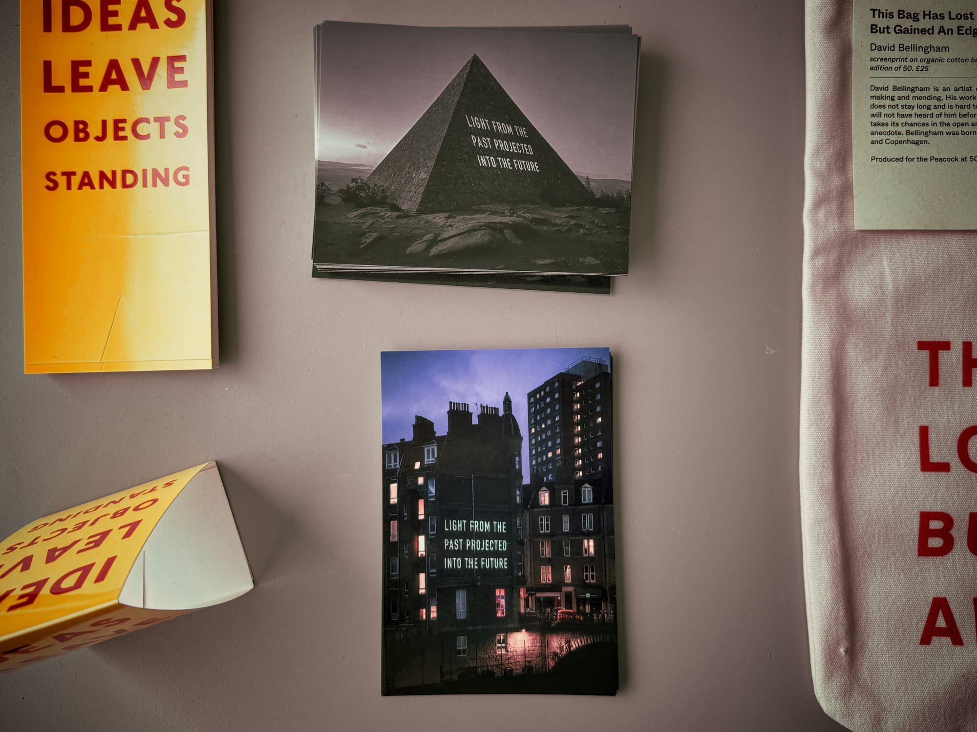 My postcard is of a building with ‘LIGHT FROM THE PAST PROJECTED INTO THE FUTURE’ projected against it